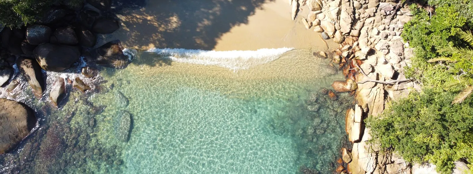 Aerial of Caxadaço cove, Ilha Grande, with turquoise water and golden sand