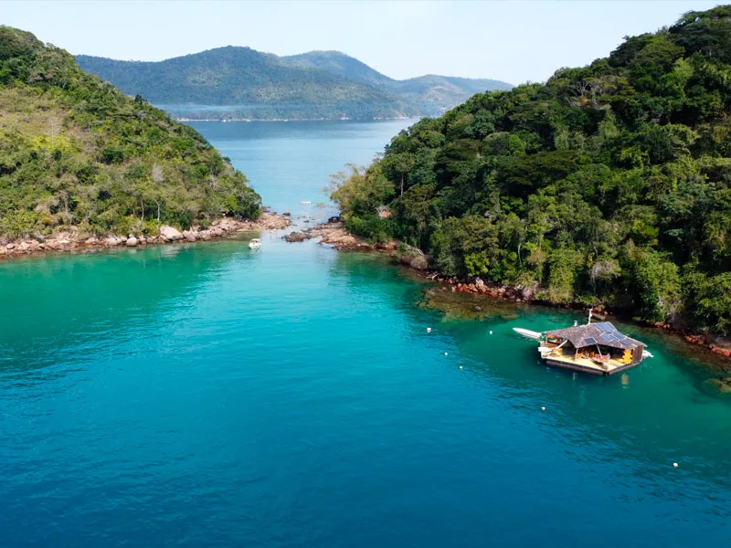 Aerial of Lagoa Azul, Ilha Grande, a turquoise snorkelling lagoon with a floating bar